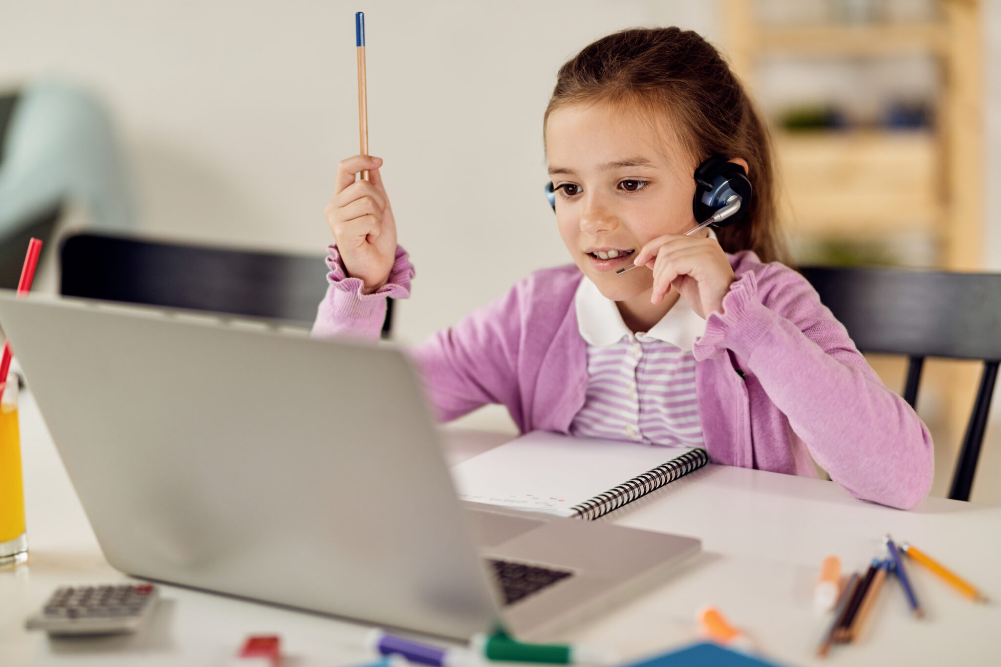 A young learner joining a live video lesson
